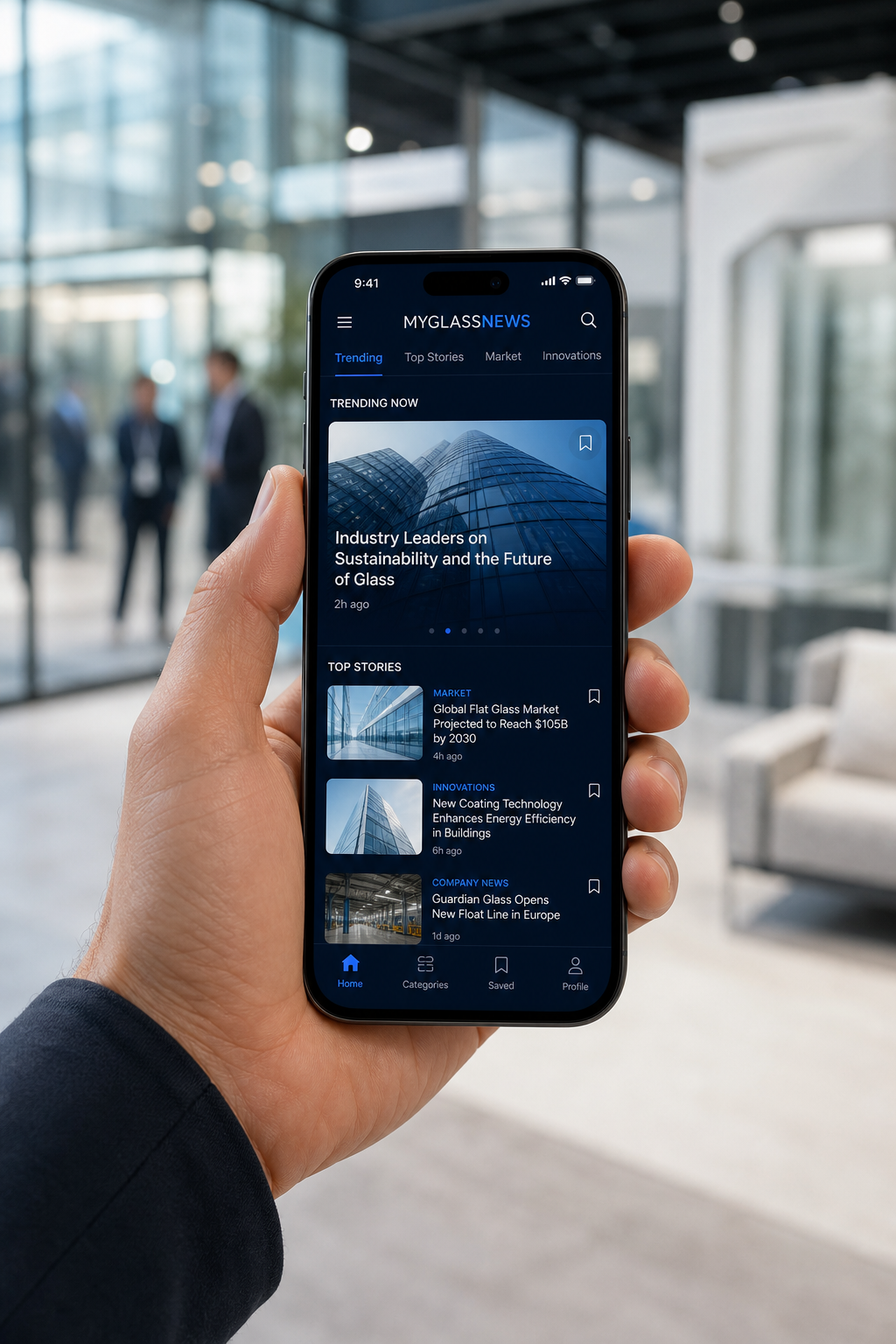 Person holding a phone with the MyGlassNews mobile app open
